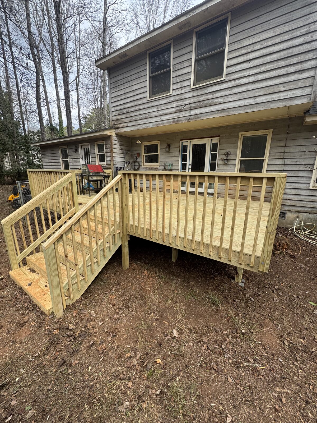 New deck construction with custom railings and stairs