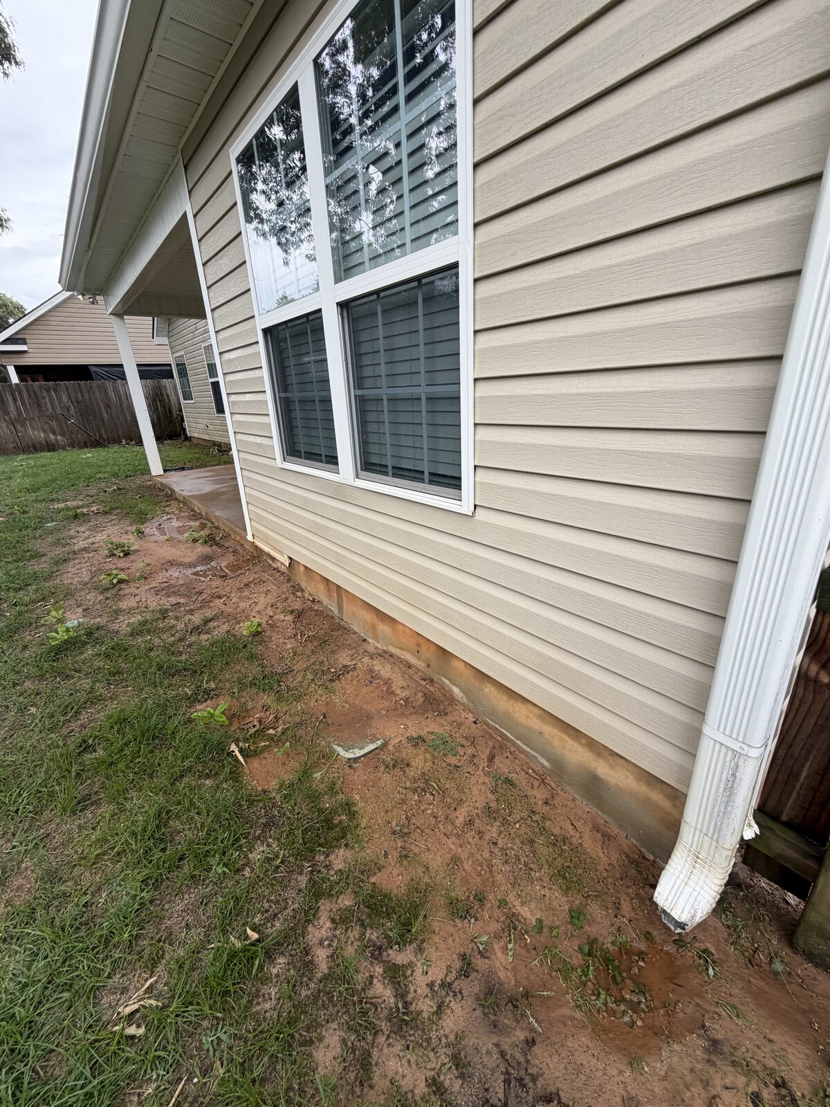 Side of home after pressure washing